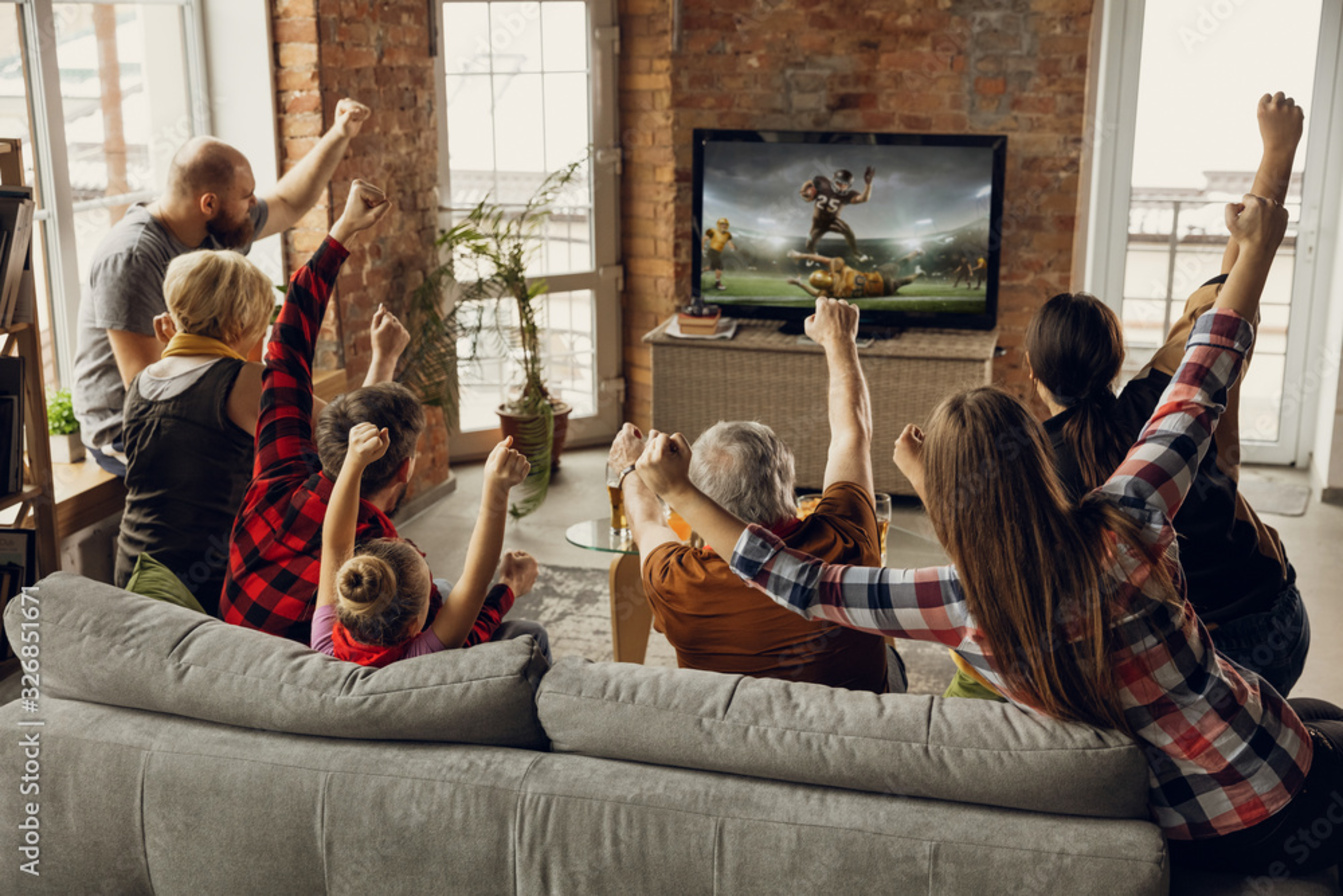 Image of a family enjoying IPTV on their TV with IPTVcrowds